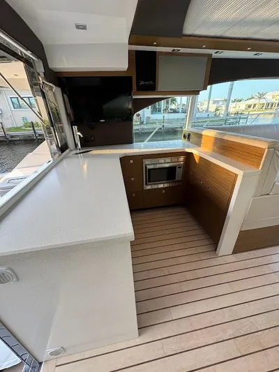  Yacht Photos Pics Modern kitchen interior of 2014 Cruisers Yachts 45 Cantius Black Diamond.