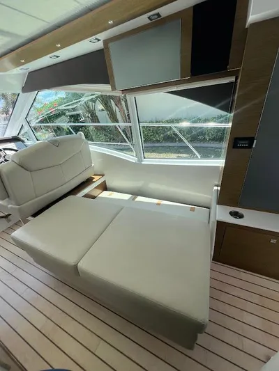  Yacht Photos Pics 2014 Cruisers Yachts 45 Cantius Black Diamond interior with modern seating and large windows.