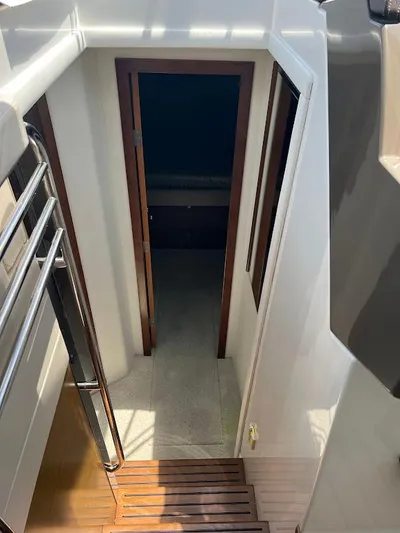  Yacht Photos Pics Stairway leading to cabin interior of 2014 Cruisers Yachts 45 Cantius Black Diamond.