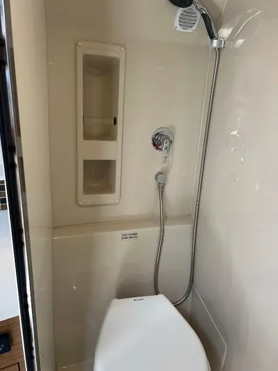  Yacht Photos Pics Bathroom interior of 2014 Cruisers Yachts 45 Cantius Black Diamond with shower and toilet.