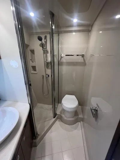  Yacht Photos Pics Bathroom interior of 2014 Cruisers Yachts 45 Cantius Black Diamond, featuring modern fixtures.