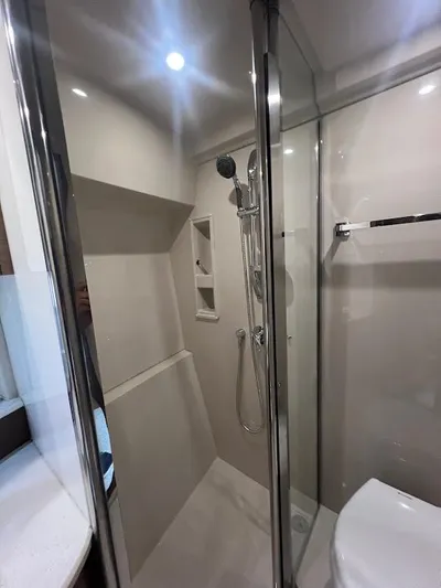  Yacht Photos Pics 2014 Cruisers Yachts 45 Cantius Black Diamond bathroom with modern shower and sleek design.