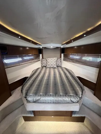  Yacht Photos Pics Luxurious interior of 2014 Cruisers Yachts 45 Cantius Black Diamond with elegant bedding.