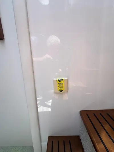  Yacht Photos Pics Staircase inside 2014 Cruisers Yachts 45 Cantius Black Diamond, featuring wooden steps and a white wall.