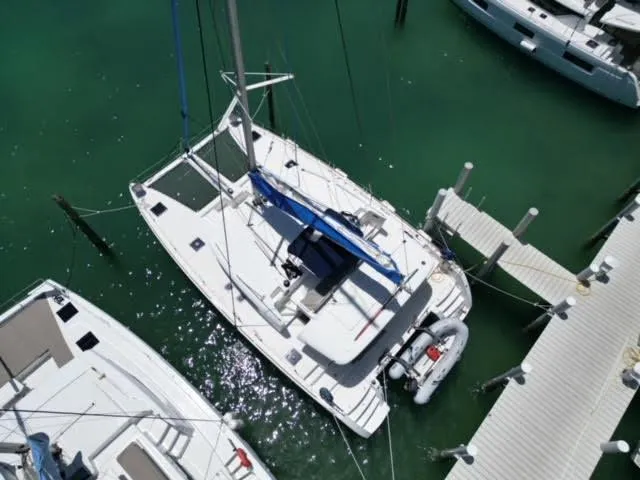 Kajsa Yacht Photos Pics Aerial view of a 2017 Lagoon 450 F catamaran docked in a marina.