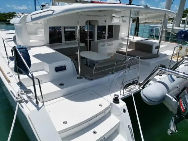 Kajsa Yacht Photos Pics Lagoon 450 F 2017 catamaran with spacious deck and seating area in marina.