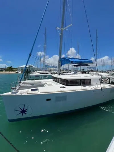 Kajsa Yacht Photos Pics 2017 Lagoon 450 F catamaran docked in a sunny marina.