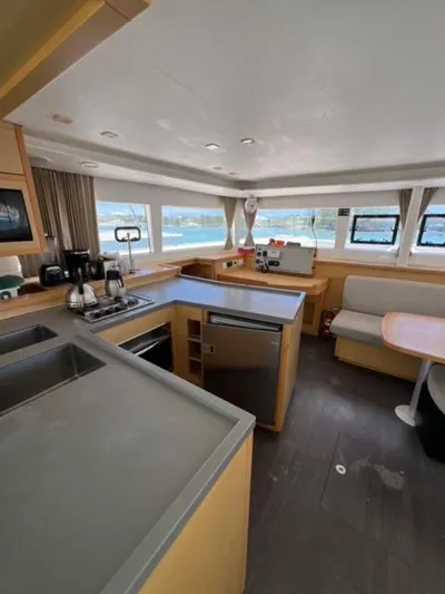 Kajsa Yacht Photos Pics Interior of 2017 Lagoon 450 F catamaran with modern kitchen and seating area.