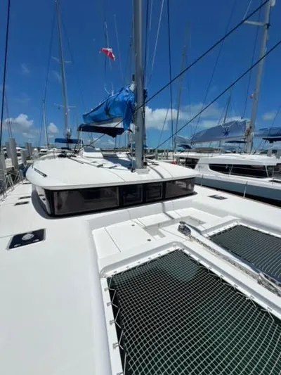 Kajsa Yacht Photos Pics 2017 Lagoon 450 F catamaran with blue sails docked under clear skies.