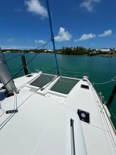 Kajsa Yacht Photos Pics 2017 Lagoon 450 F catamaran on calm water under clear blue sky.