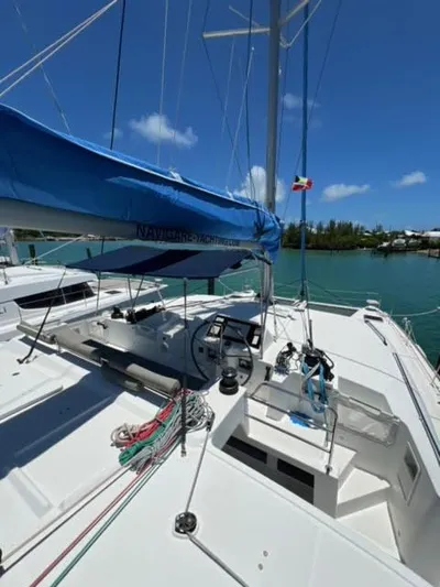 Kajsa Yacht Photos Pics 2017 Lagoon 450 F catamaran with blue sail cover, docked in sunny marina.