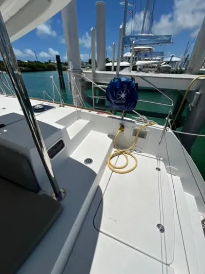 Kajsa Yacht Photos Pics 2017 Lagoon 450 F yacht deck with marina view and clear blue sky.