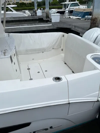 Don't Stop Believin Yacht Photos Pics 2022 Regal 33 SAV boat docked, featuring a spacious white deck area.