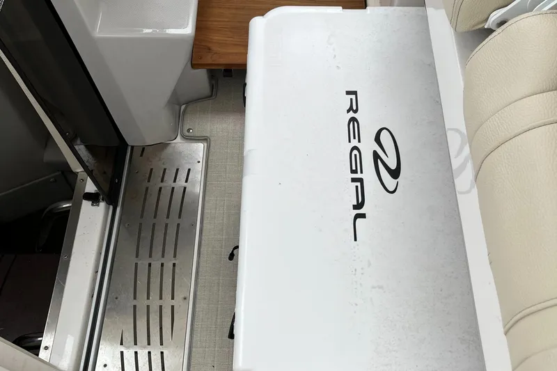 Don't Stop Believin Yacht Photos Pics 2022 Regal 33 SAV boat interior with branded seating and sleek design.