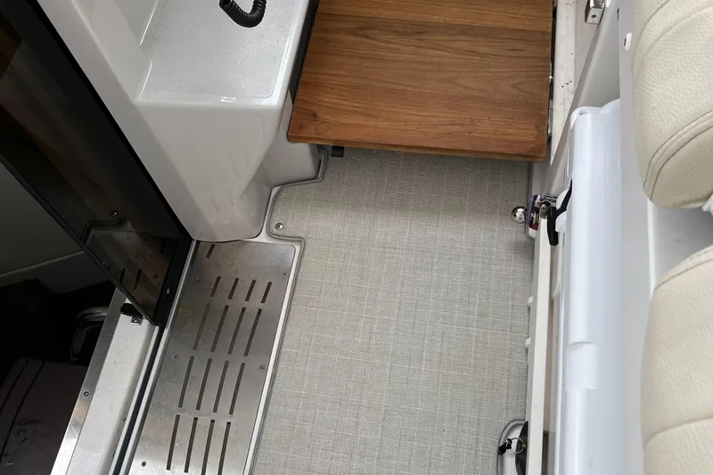 Don't Stop Believin Yacht Photos Pics Interior view of 2022 Regal 33 SAV boat, featuring sleek flooring and wooden accents.