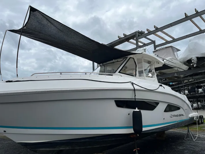 Don't Stop Believin Yacht Photos Pics 2022 Regal 33 SAV boat on display, featuring sleek design and modern features.