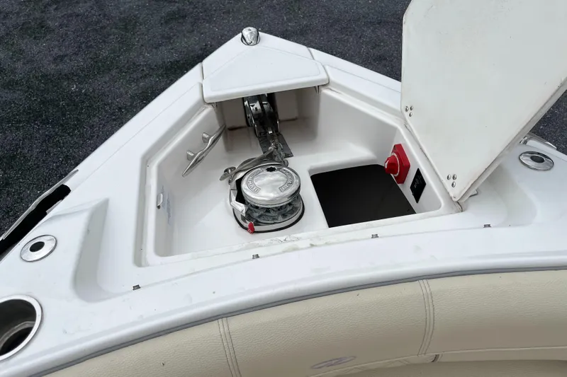 Don't Stop Believin Yacht Photos Pics Anchor compartment of 2022 Regal 33 SAV boat, featuring a winch and storage space.