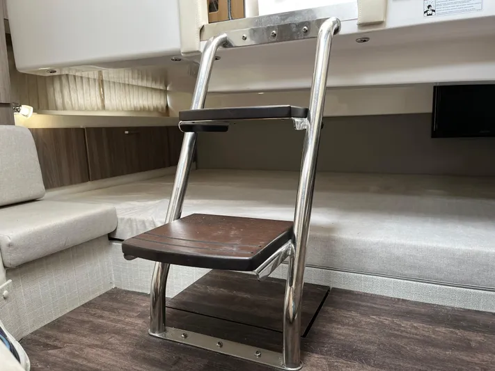 Don't Stop Believin Yacht Photos Pics Interior of 2022 Regal 33 SAV boat with metal and wood ladder.
