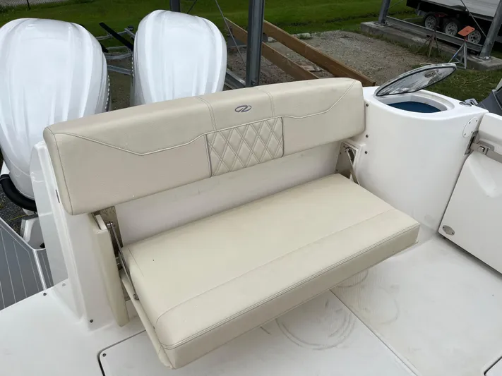 Don't Stop Believin Yacht Photos Pics 2022 Regal 33 SAV boat with beige leather seating and dual outboard motors.