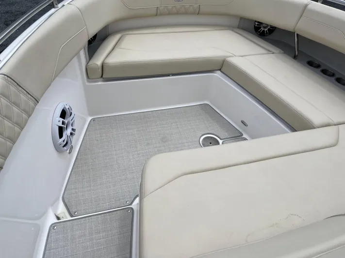 Don't Stop Believin Yacht Photos Pics Luxurious seating area on a 2022 Regal 33 SAV boat with beige upholstery.
