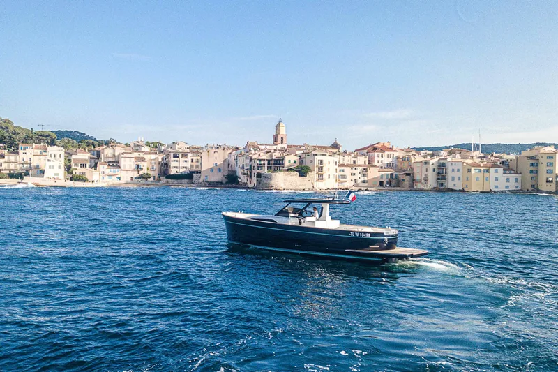  Yacht Photos Pics 2023 Apreamare Gozzo 45 cruising near picturesque coastal town.