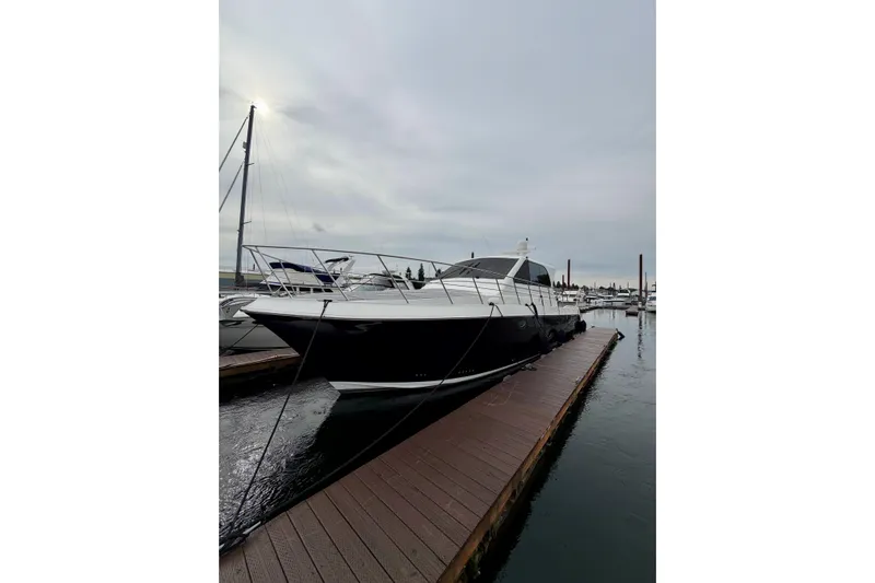  Yacht Photos Pics 2009 Navigator California 50 Veneti yacht docked at marina under cloudy sky.