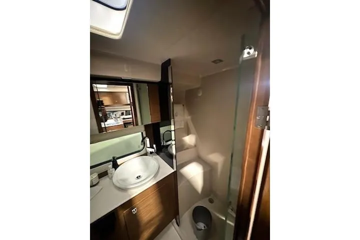 Branch Office Yacht Photos Pics 2016 Cruisers 390 Express yacht bathroom with modern sink and shower.