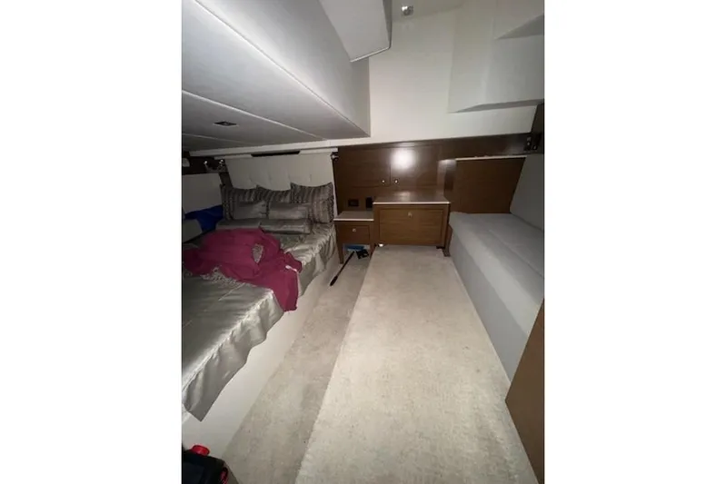 Branch Office Yacht Photos Pics 2016 Cruisers 390 Express cabin interior with bed and seating area.