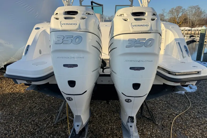  Yacht Photos Pics 2017 Boston Whaler 320 Vantage with twin 350 Verado engines, docked outdoors.