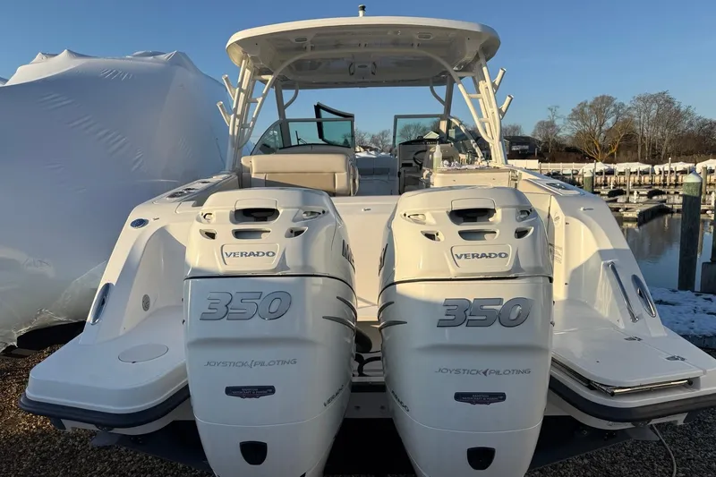  Yacht Photos Pics 2017 Boston Whaler 320 Vantage with twin Verado 350 engines at a marina.