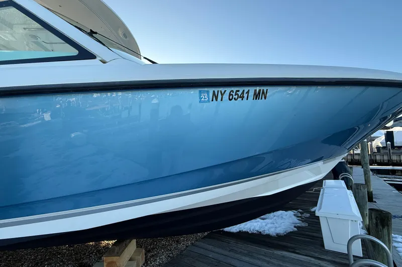  Yacht Photos Pics 2017 Boston Whaler 320 Vantage boat docked, displaying registration number NY 6541 MN.