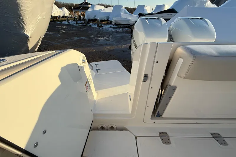  Yacht Photos Pics 2017 Boston Whaler 320 Vantage boat with dual Mercury engines, docked in a marina.