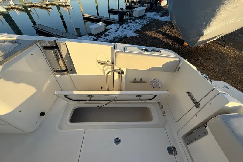  Yacht Photos Pics 2017 Boston Whaler 320 Vantage boat interior with open storage compartment.