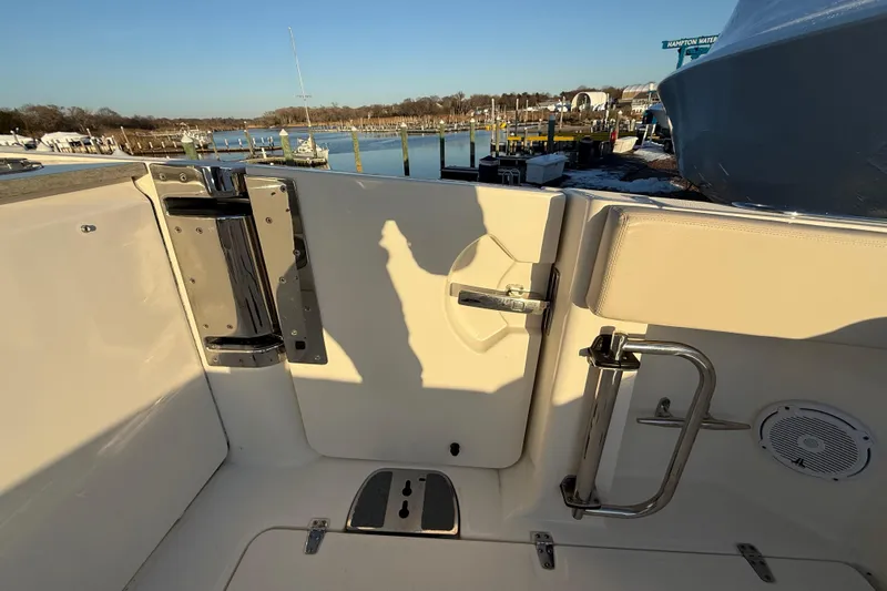  Yacht Photos Pics 2017 Boston Whaler 320 Vantage boat interior with dock view, featuring stainless steel fixtures.