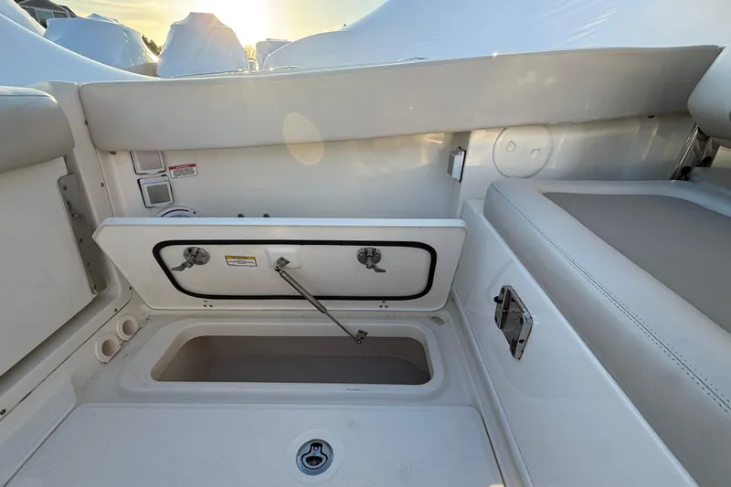  Yacht Photos Pics 2017 Boston Whaler 320 Vantage boat storage compartment with open hatch.