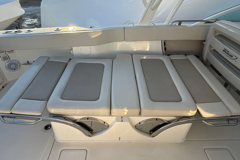  Yacht Photos Pics 2017 Boston Whaler 320 Vantage boat seating area with cushioned seats and stainless steel accents.