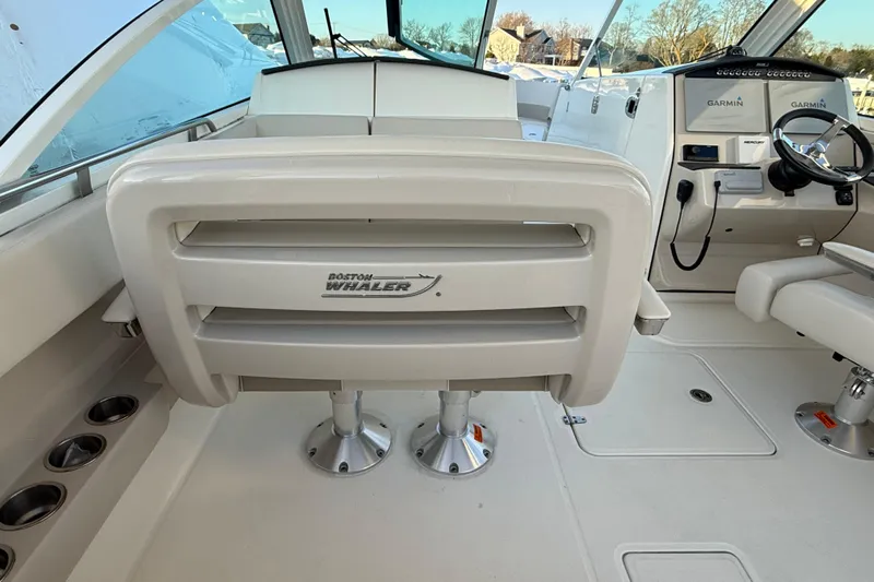  Yacht Photos Pics 2017 Boston Whaler 320 Vantage boat interior with helm and seating area.