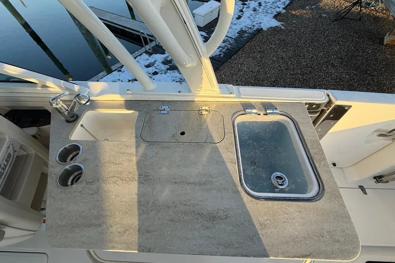  Yacht Photos Pics Boston Whaler 320 Vantage 2017 boat sink and countertop with cup holders.