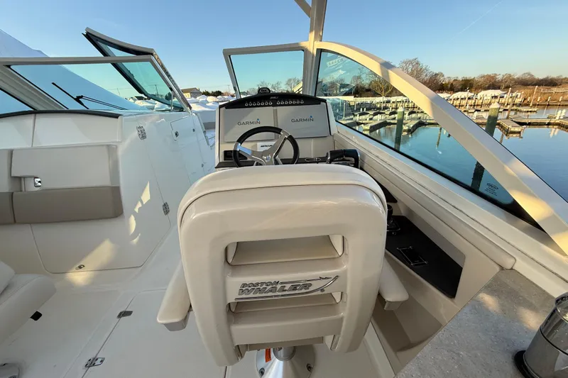  Yacht Photos Pics 2017 Boston Whaler 320 Vantage boat cockpit with Garmin navigation system, dockside view.