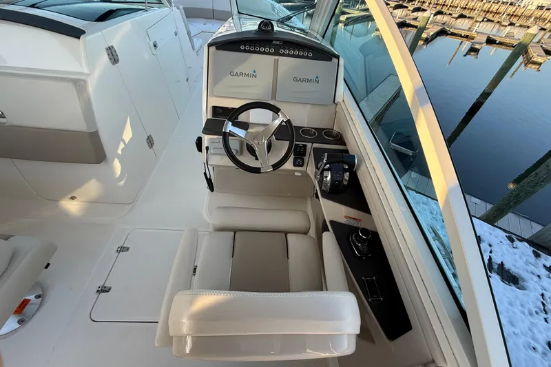  Yacht Photos Pics 2017 Boston Whaler 320 Vantage helm with Garmin navigation, docked by snowy pier.