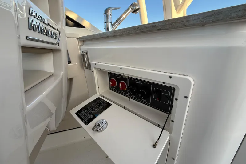  Yacht Photos Pics 2017 Boston Whaler 320 Vantage control panel with ignition switches and faucet.