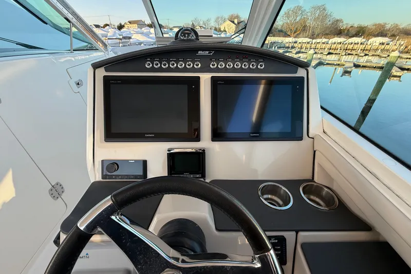  Yacht Photos Pics 2017 Boston Whaler 320 Vantage helm with dual Garmin displays and cup holders.