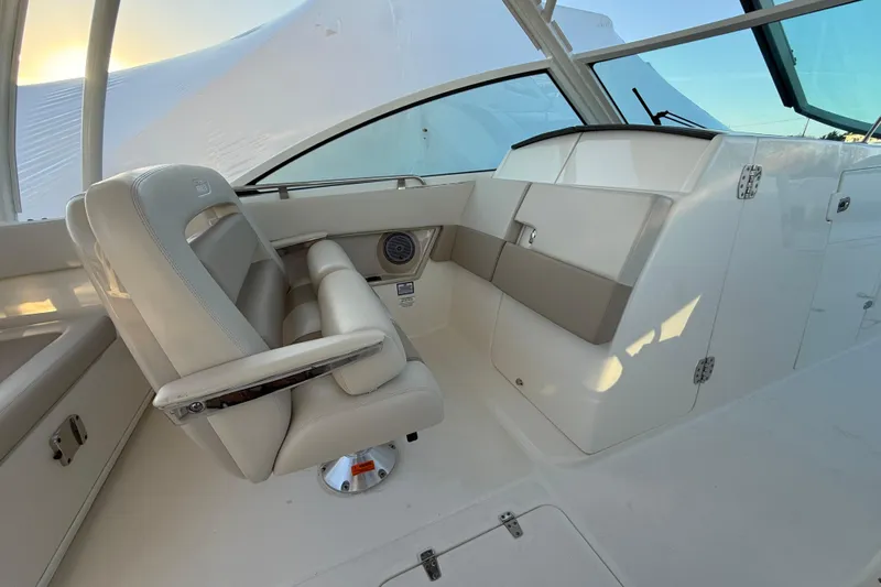  Yacht Photos Pics 2017 Boston Whaler 320 Vantage interior with beige seating and modern design.