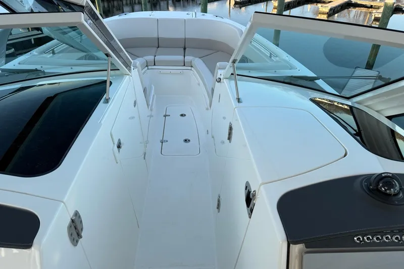  Yacht Photos Pics 2017 Boston Whaler 320 Vantage boat interior with seating and open deck view.