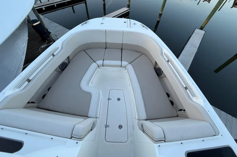  Yacht Photos Pics 2017 Boston Whaler 320 Vantage boat interior with cushioned seating at dock.