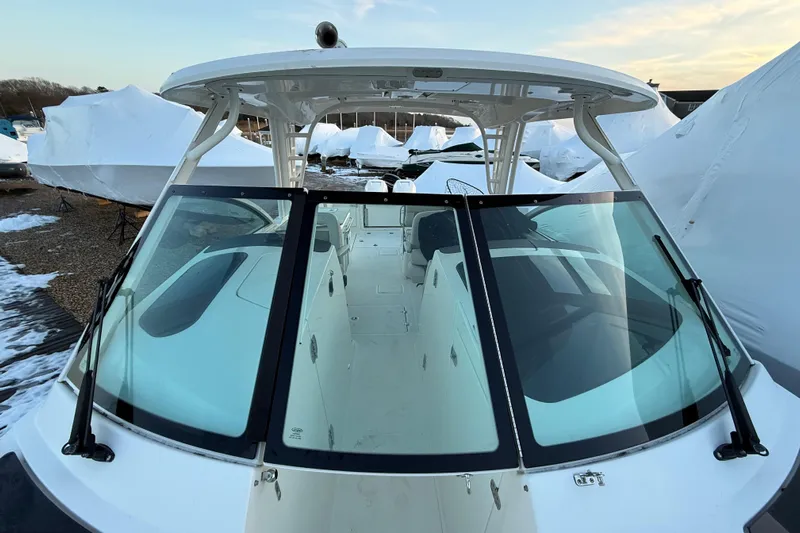  Yacht Photos Pics 2017 Boston Whaler 320 Vantage boat with sleek windshield and covered storage.