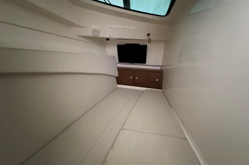  Yacht Photos Pics Interior cabin of 2017 Boston Whaler 320 Vantage with cushioned seating and storage.