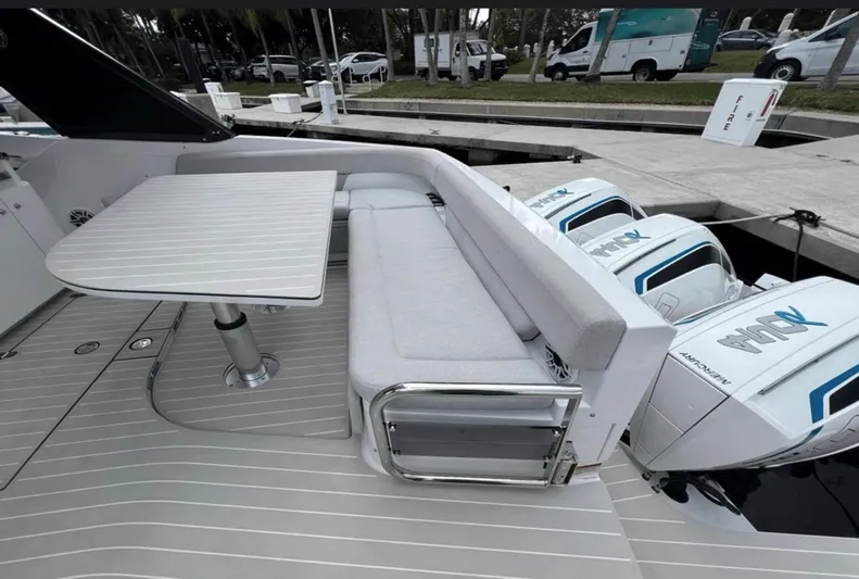  Yacht Photos Pics Azimut Verve 42 yacht deck with seating, table, and powerful outboard engines, 2022 model.