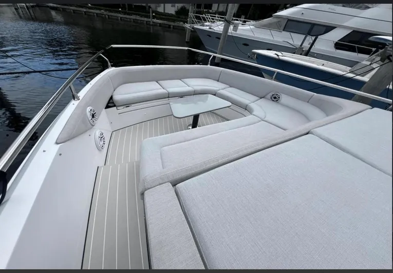  Yacht Photos Pics Luxurious seating area on 2022 Azimut Verve 42 yacht, docked by the water.