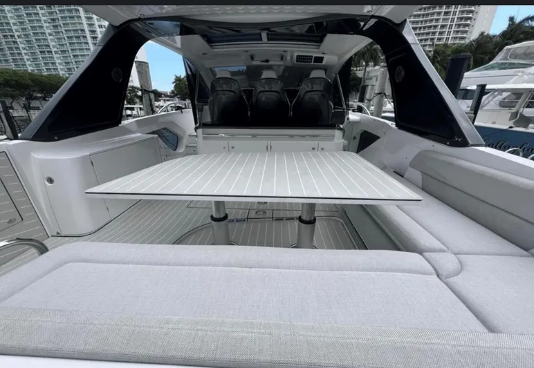  Yacht Photos Pics 2022 Azimut Verve 42 yacht interior with sleek seating and modern table design.